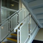 Perforated steel panel balustrades in a new factory's office block.